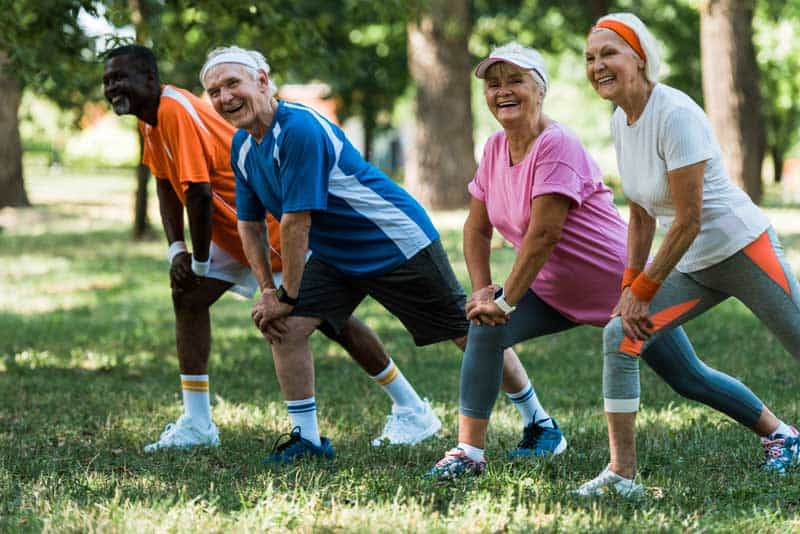 group-of-seniors-stretching-outdoors